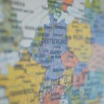 Close-up view of Germany on a colorful world map showing major cities.