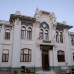 Facade of Fatih Sultan Mehmet University in Istanbul, showcasing Ottoman architectural design.
